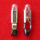 Two miniature lamps 28V 50mA t4.8x22mm on red background